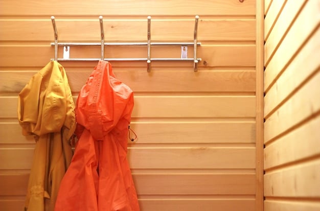 A close-up of a cedar closet with hanging clothes and cedar blocks visible. The wood grain of the cedar walls is prominent, and the clothes are neatly spaced.