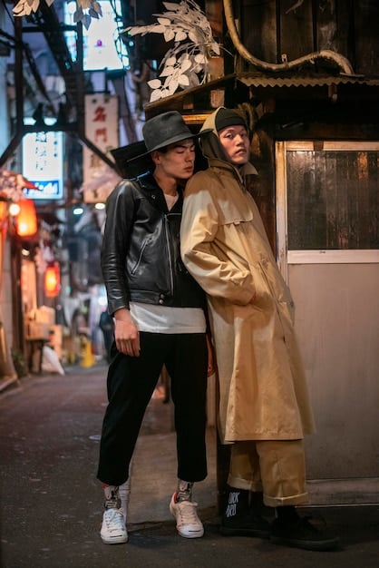 A modern-day photograph of Hiroshi Fujiwara, showcasing his sophisticated streetwear style and capturing his enduring influence on the fashion industry.