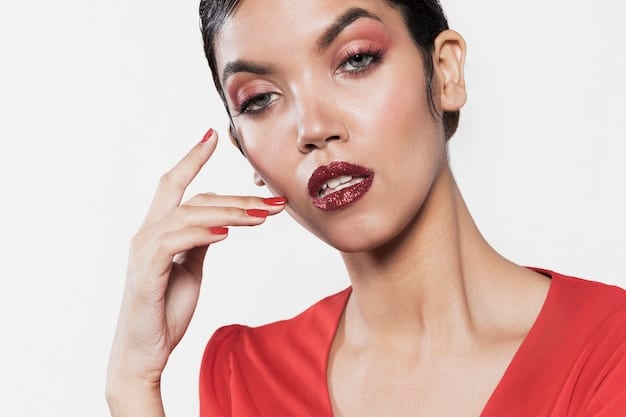 A split image showing a dark-skinned woman wearing a deep burgundy lipstick on one side and a bright, classic red on the other, demonstrating the versatility of reds for dark skin tones.