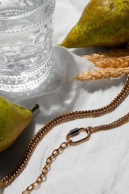 A detailed shot of a selection of affordable jewelry pieces, including gold hoop earrings, a delicate chain necklace, and a simple bracelet.