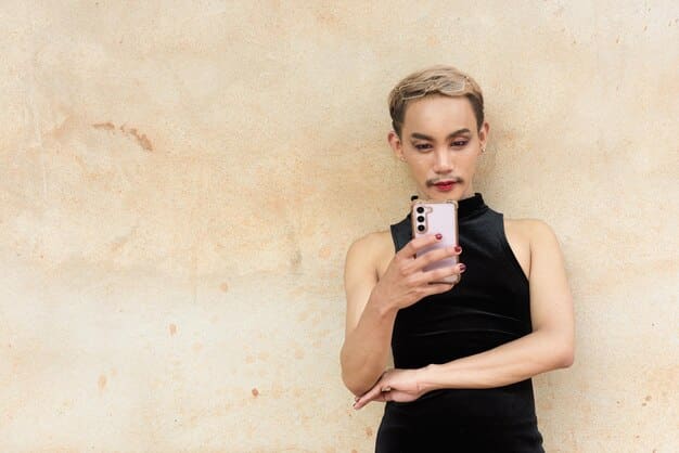 Close-up shot of a celebrity's (e.g., Hailey Bieber) hand holding a phone with a detailed, colorful bead phone charm. Focus on the charm itself, highlighting the different beads and characters. The background should be slightly blurred.