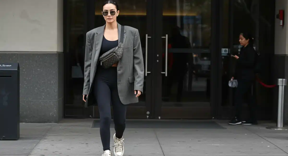 Celebrity transitioning athleisure from gym to street with a blazer and designer accessories