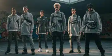 Diverse individuals displaying modern street style in an urban setting, reflecting evolving fashion.