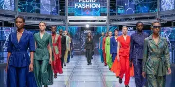 Diverse models showcasing fluid fashion on a futuristic runway, representing gender-neutral style in 2026.